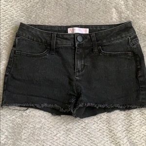Low-rise black denim shorts